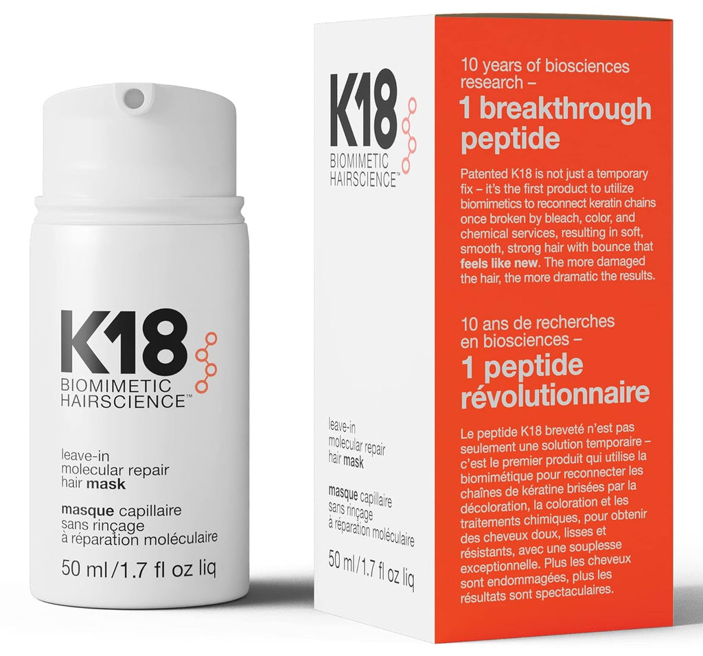 K18 Biomimetic Hairscience leave-in molecular repair hair mask bottle next to its retail box, featuring white and light red packaging with black text.